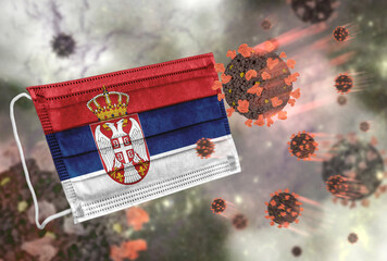 Face mask with flag of Serbia, defending coronavirus - 379806701