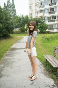 Cute Asian woman Playing Outdoors
