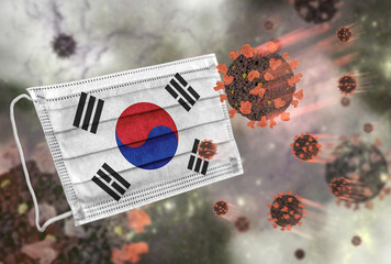 Face mask with flag of South Korea, defending coronavirus - 379807163