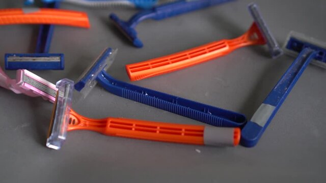 Used old dirty plastic disposable razors. Plastic disposable razors contribute a massive amount of plastic and toxic chemicals to global pollution rates