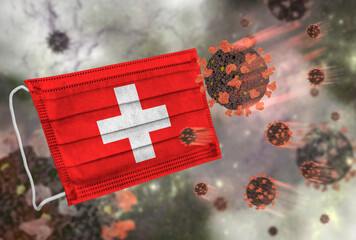Face mask with flag of Switzerland, defending coronavirus - 379807551
