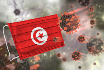 Face mask with flag of Tunisia, defending coronavirus - 379807910