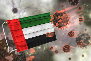 Face mask with flag of United Arab Emirates, defending coronavirus - 379808181