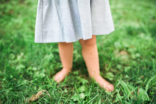 Two young twins playing outside in the summertime