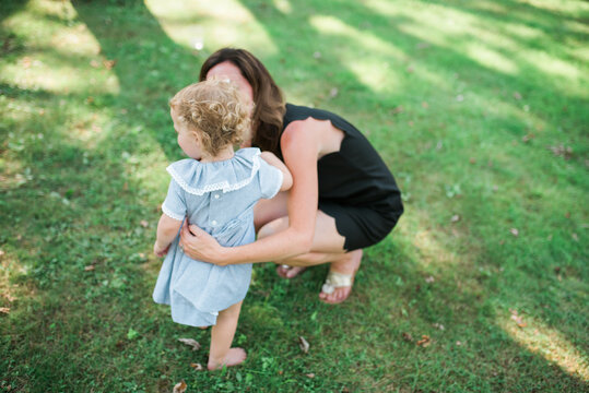 Two young twins playing outside in the summertime