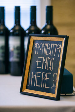 Shower: Humorous Sign By Wine On Table