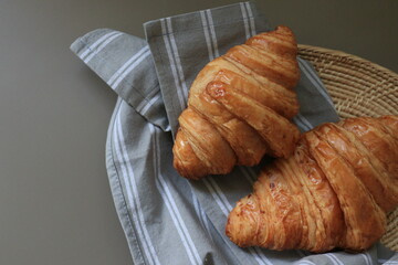Croissants , French Pastry , on Grey Napkin in a basket
