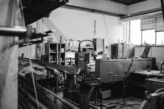 untidy workshop from a metal worker with tools - black and white
