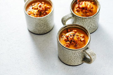 Hearty winter soup in mugs