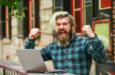 Stock trader. Online business. Online entrepreneur working outdoors. Man busy work with laptop....