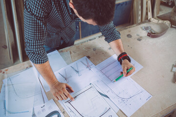 Furniture Designer Working on His Blueprint