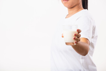 Woman use hands hold drink white milk from a glass