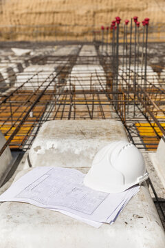 Nlueprints and a helmet on construction site