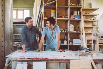 Two Carpenters Designing