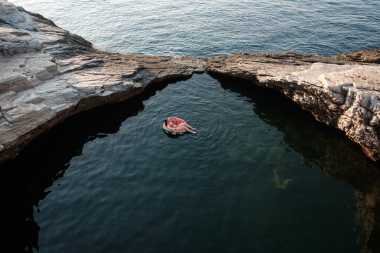 Woman Floating on Inflatable Tube in the Sea
