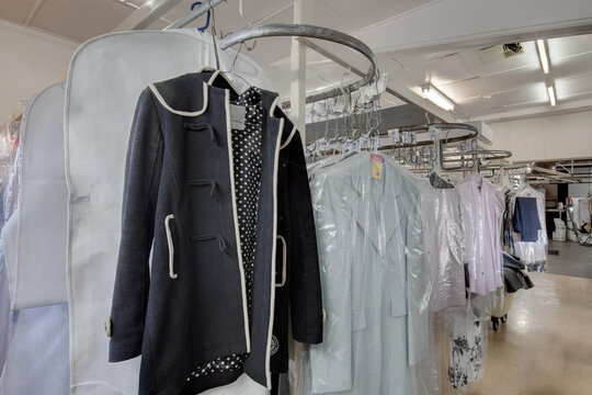 Clothes hung waiting for collection at dry cleaners