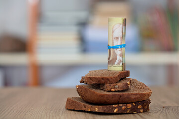 Black bread and Canadian dollar banknotes