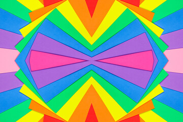 An abstract geometric textured background of multicolored rainbow colors created with overlapping foam craft paper 