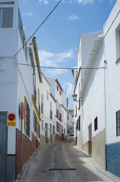 Fototapeta Narrow street in small Spanish village