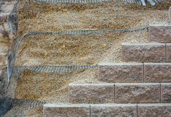 Retaining wall using geo grid for reinforcement