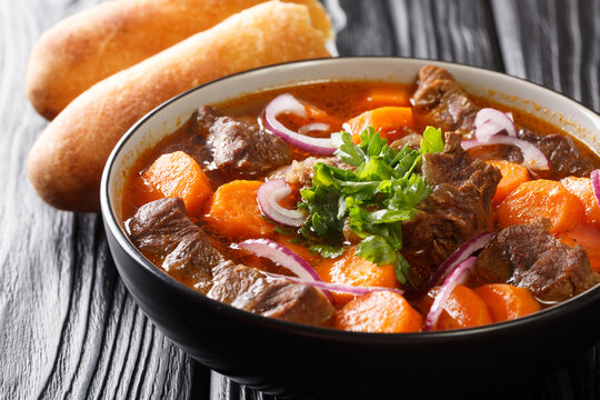 Authentic Vietnamese Beef Stew Bo Kho closeup in bowl on the table. Horizontal