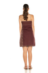 Back of a woman with a dress, isolated on white.