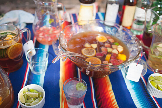 Party time - table top with festive fruit punch and alcoholic drinks