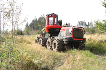 a forest harvester in the fir forest