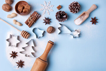 Fototapeta na wymiar Flat lay preparing Christmas gingerbread, ingredients on a blue background