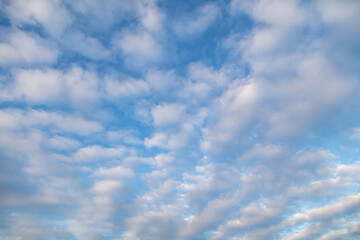 Clouds against blue sky as background.