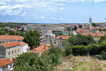 Fototapeta na wymiar City of Pula with amphitheatre and church tower from distance