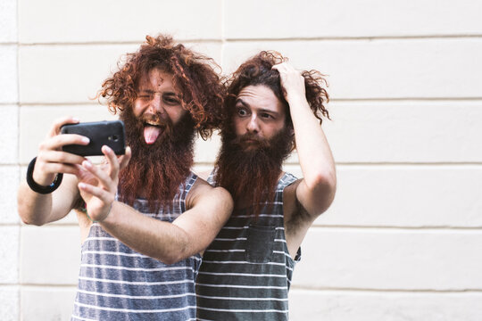 Twins taking a selfie