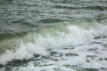 Wave in the sea with splashing water.