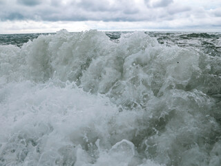 Wave in the sea with splashing water.