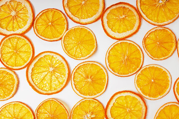 Fototapeta premium Dried orange slices close-up on the white background