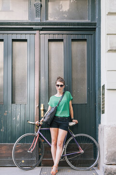 Young woman with a fixed gear bike in an urban environment