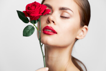 Woman with rose Close-up with closed eyes charm light 