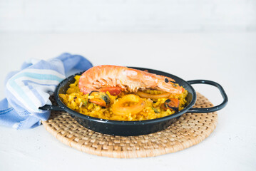 Paella typical spanish food in granite background