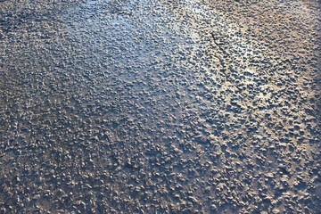 Old asphalt pavement with a crack in the contour lighting