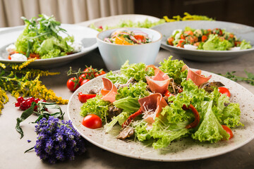 many beautiful dishes and salads for the buffet