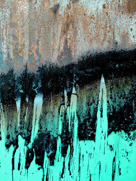 Close up of dripping toxic sludge on rusty, metal trash canister