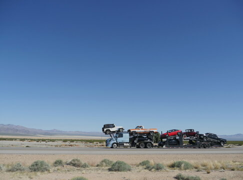Tow truck loaded with cars