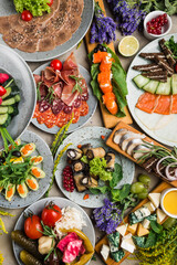many beautiful dishes and salads for the buffet