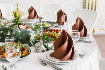 table setting with cutlery and dishes in the restaurant