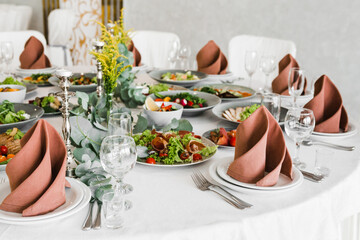 table setting with cutlery and dishes in the restaurant