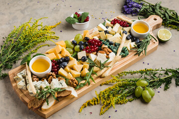 assortment of different cheeses and snacks for wine and beer