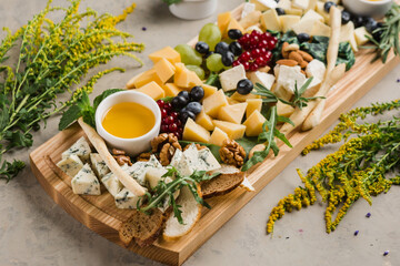 assortment of different cheeses and snacks for wine and beer