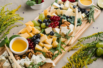 assortment of different cheeses and snacks for wine and beer