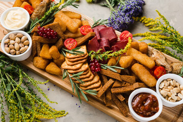 assortment of different snacks and nuggets for beer