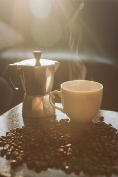 homemade fresh coffee cup wit a percolator and coffee beans
